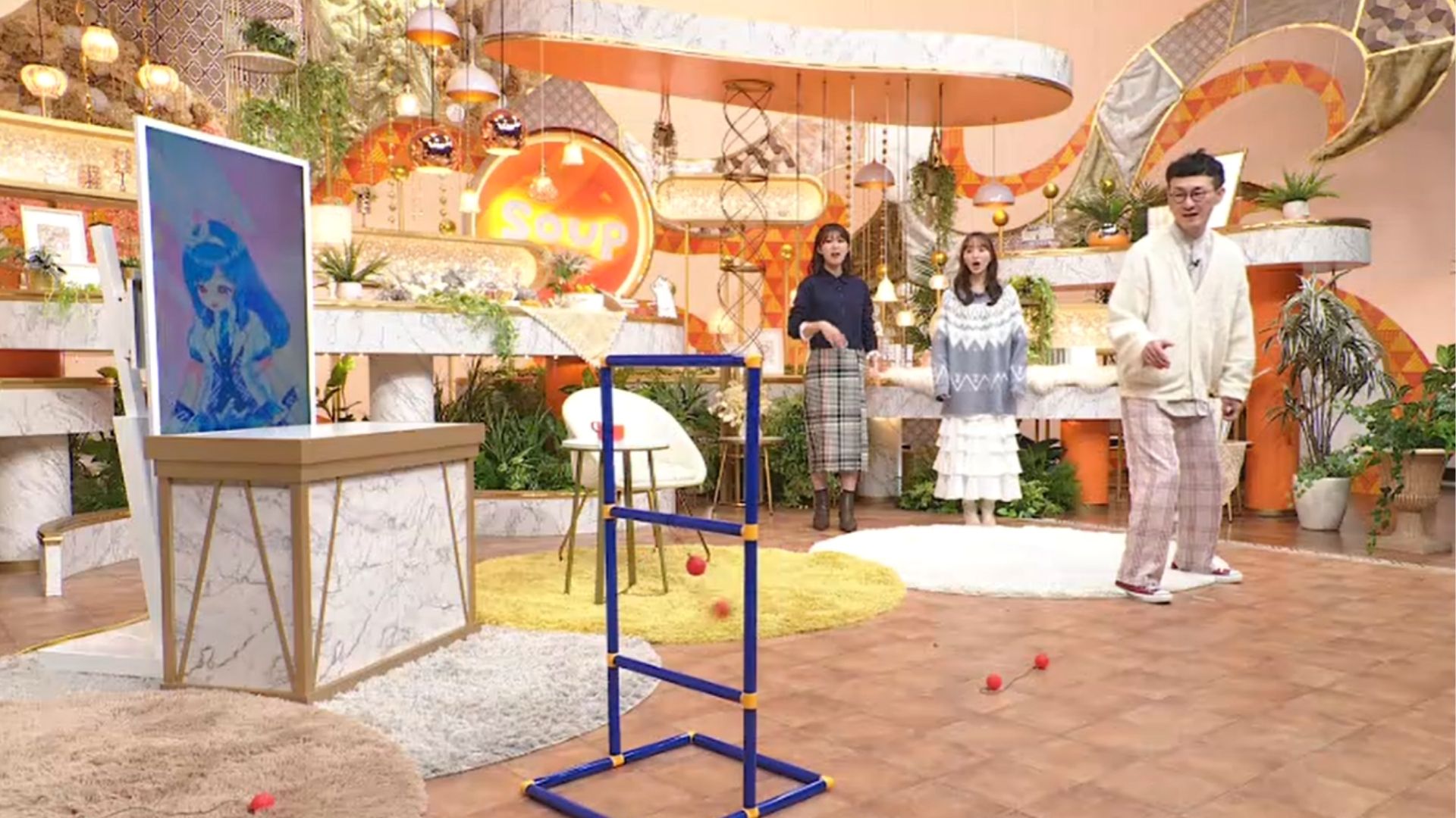 ラダーハングゲームに挑戦するロバート馬場裕之と山根千佳